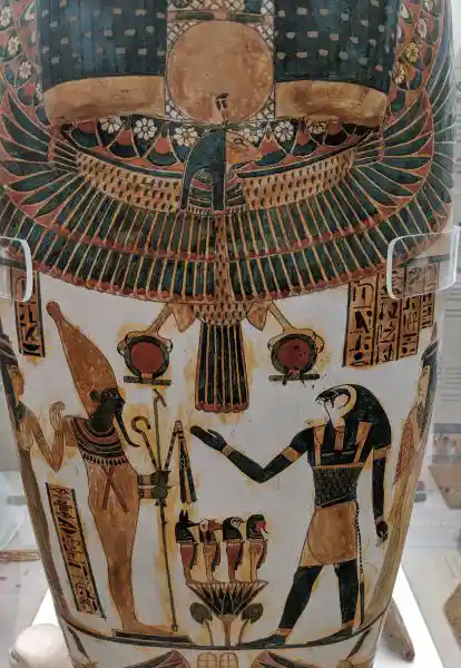 Ancient Egyptian painted wooden coffin showing Osiris, Horus, and the Four Sons of Horus